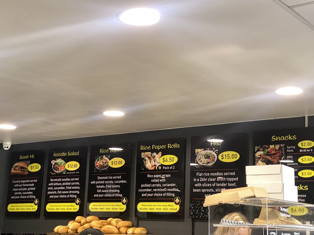 Bánh Mì Factory Zillmere menu board showing banh mi, noodle salad, rice paper rolls and pho prices